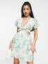 Фото #1 товара ASOS DESIGN soft tiered mini dress with tie waist detail in green floral
