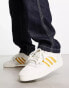 adidas Originals Rivalry Low trainers in white/gold