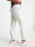 Фото #7 товара Miss Selfridge baggy cargo pant with elasticated hem in stone