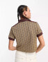 Lacoste cropped polo shirt in brown with all over print