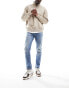 Фото #1 товара ASOS DESIGN skinny jeans in mid wash blue