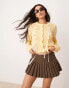 Фото #1 товара ASOS DESIGN crew neck cardigan in open stitch with bow detail in yellow