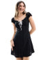 Фото #1 товара Miss Selfridge milkmaid mini dress with contrast ribbons in black