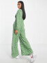 Glamorous Petite v-neck button front jumpsuit in green mini daisy print