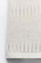 Sleeveless metallic thread knit top