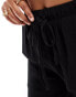 In The Style x Perrie Sian exclusive textured tie waist wide leg beach trousers in black