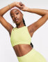 South Beach rib light support cutout detail sports bra in olive green