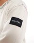 Calvin Klein running logo comfort sweatshirt in beige - exclusive to ASOS