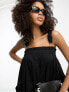 ASOS Design – Trapezförmiges Latzhosen-Sommerkleid aus Baumwolle in Schwarz