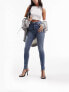 ASOS DESIGN ultimate skinny jeans in distressed blue