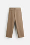 BELTED PLEATED TROUSERS