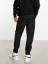 Фото #2 товара Nike Club woven tapered trousers in black