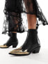 Фото #7 товара AllSaints Dellaware leather ankle boot in black with gold flame toe