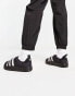 adidas Originals Puffylette in black with white detail