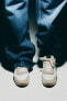 Фото #1 товара Кроссовки в беговом стиле из кожи с контрастными деталями ZARA