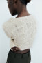 Asymmetric cropped knit sweater
