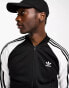 adidas Originals Superstar trackjacket in black and white