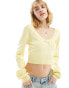 ASOS DESIGN knitted long sleeve top in pointelle stitch with contrast bow detail in lemon