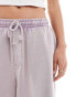 Фото #3 товара ASOS DESIGN unisex oversized shorts in washed lilac