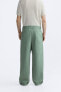 Relaxed fit trousers with belt