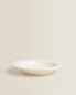 Earthenware soup plate with raised-design edge