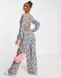 Фото #1 товара ASOS DESIGN bubble crepe button back long sleeve jumpsuit in blue floral