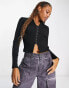 Фото #1 товара Urban Revivo textured eyelet polo top in black