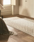 Rectangular floral block print rug with fringing