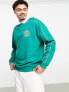 ASOS DESIGN oversized rugby sweatshirt with piping in green