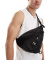 Фото #1 товара Calvin Klein Jeans rounded sling bag in black