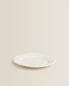 Earthenware dessert plate with raised-design edge