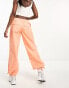 ASOS DESIGN parachute cargo trouser with seam detail in washed coral