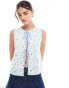 ASOS DESIGN tie front top with contrast binding in ditsy print