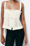 Embroidered ruffled top