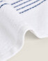 Stitched border cotton towel