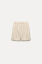 High-waist pleated bermuda shorts