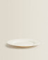 Earthenware dinner dish with raised-design edge