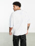 ASOS DESIGN oversized t-shirt in blue wash with gothic text chest print