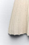 Rustic knit skirt with pleats