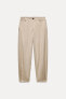 CHINO TROUSERS WITH DARTED HEMS