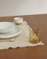 Checked linen placemat with fringing