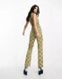 ASOS DESIGN twill belted zip front sleeveless jumpsuit in geo print