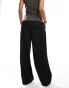 Mango slouchy mid waist trousers in black