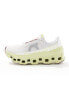 ON Cloudmonster running trainers in white and yellow