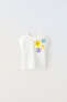 T-shirt with floral appliqué