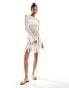 Фото #1 товара In The Style crochet one sleeve fringe detail mini dress in cream