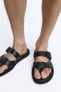 Strappy sandals with buckle fastening
