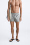 Check-texture swimming trunks