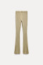 FADED-EFFECT RIBBED FLARED TROUSERS