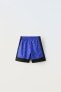 Sporty football bermuda shorts